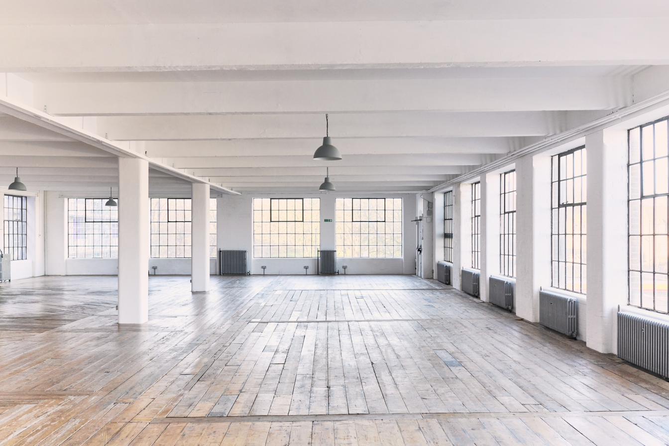 Nest — reclaimed timber floors with white painted columns